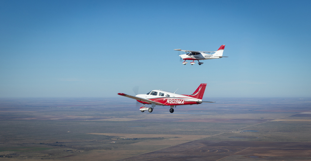 two planes flying in formation